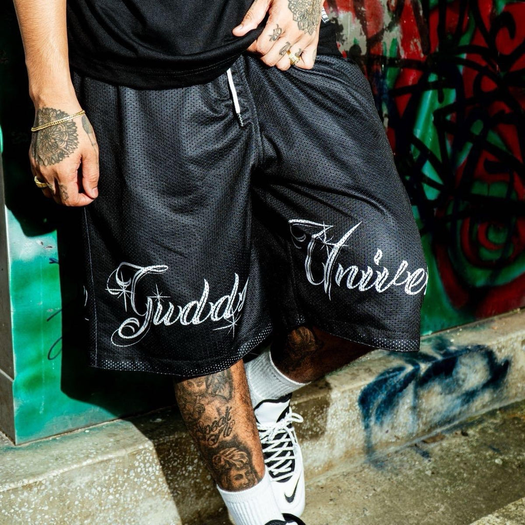 “CHICANO SCRIPT" MESH SHORTS