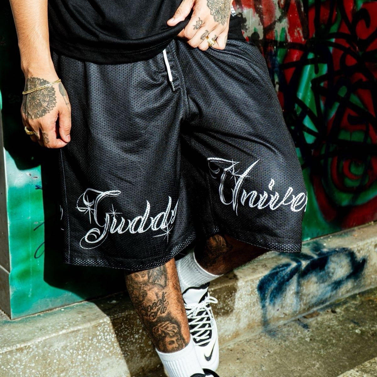 “CHICANO SCRIPT" MESH SHORTS