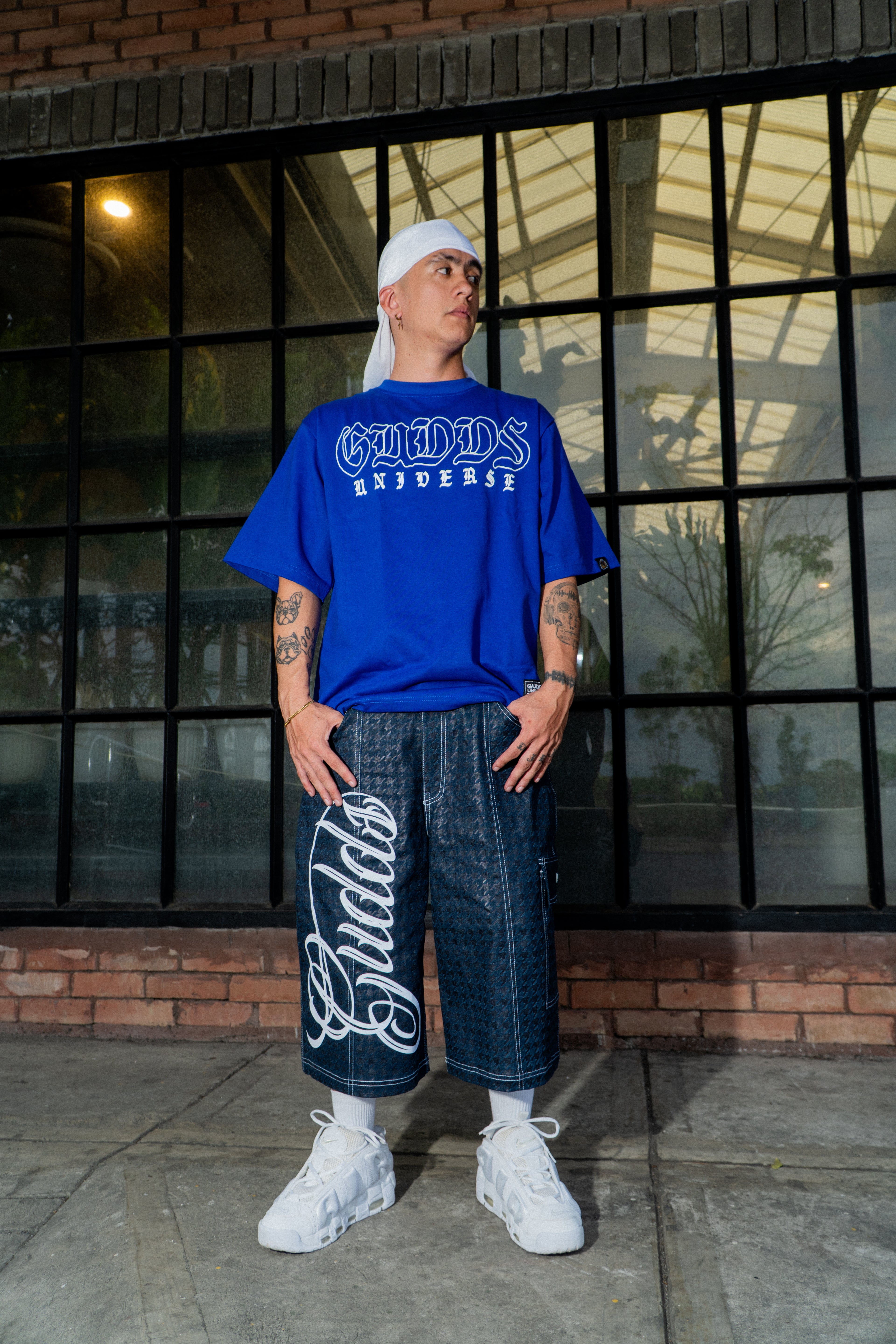 GUDDS UNIVERSE - "NEVA FOLD" BIG BACK PRINT TEE!