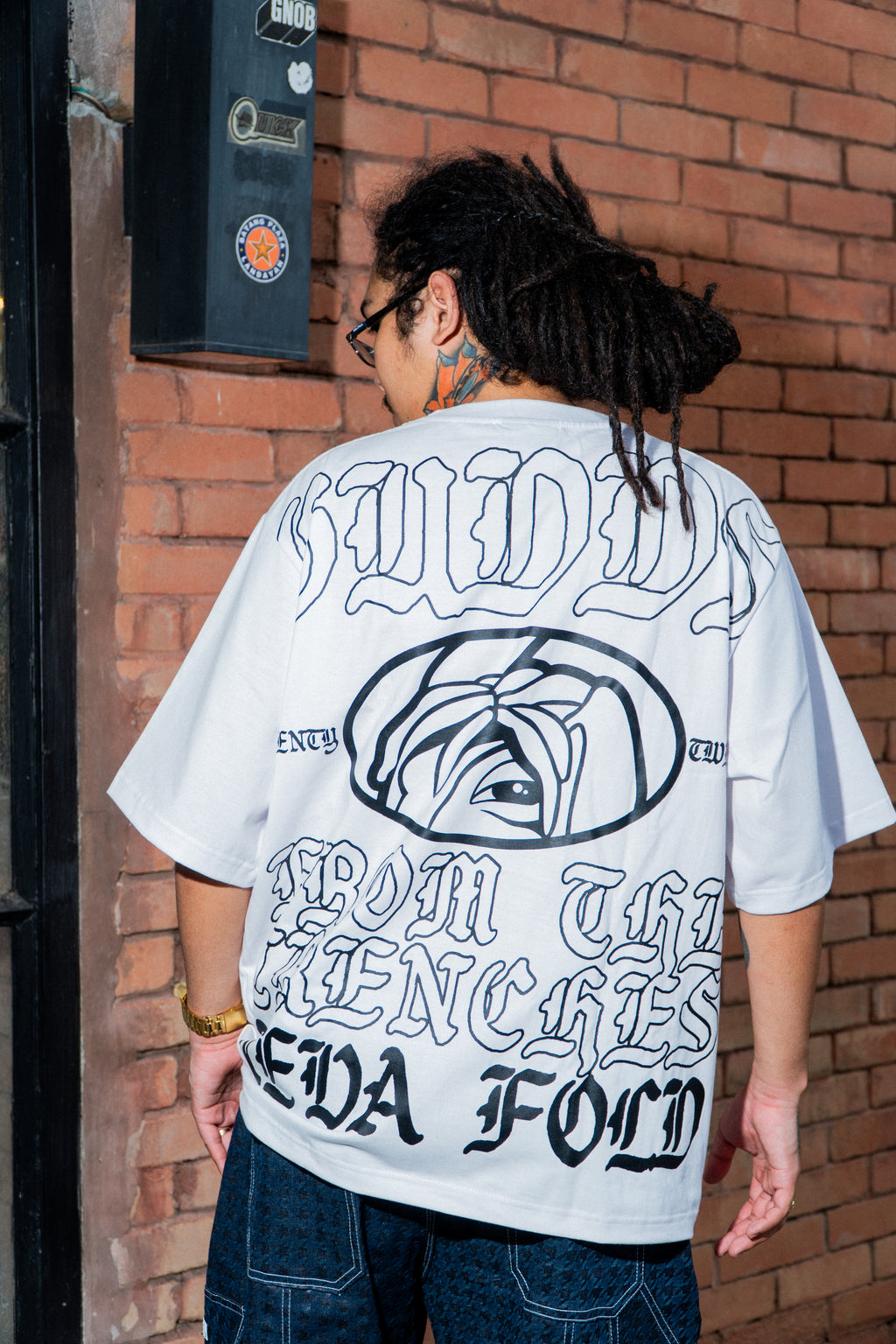 GUDDS UNIVERSE - "NEVA FOLD" BIG BACK PRINT TEE!