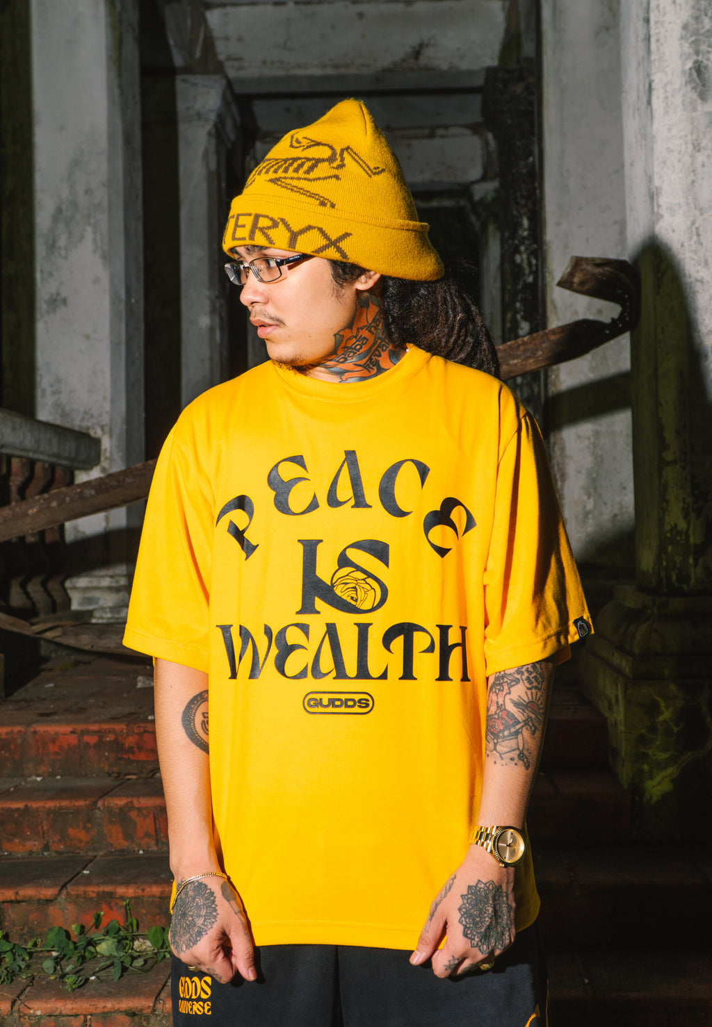 “PEACE IS WEALTH” GRAPHIC TEE