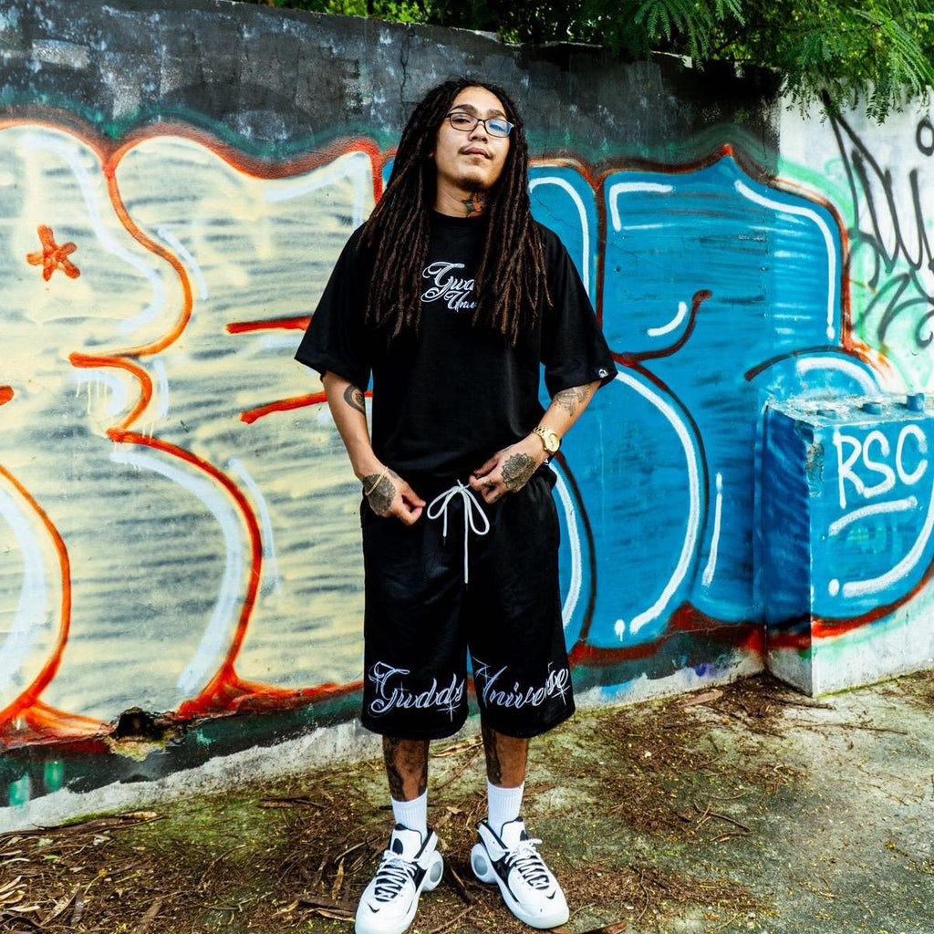 “CHICANO SCRIPT" MESH SHORTS