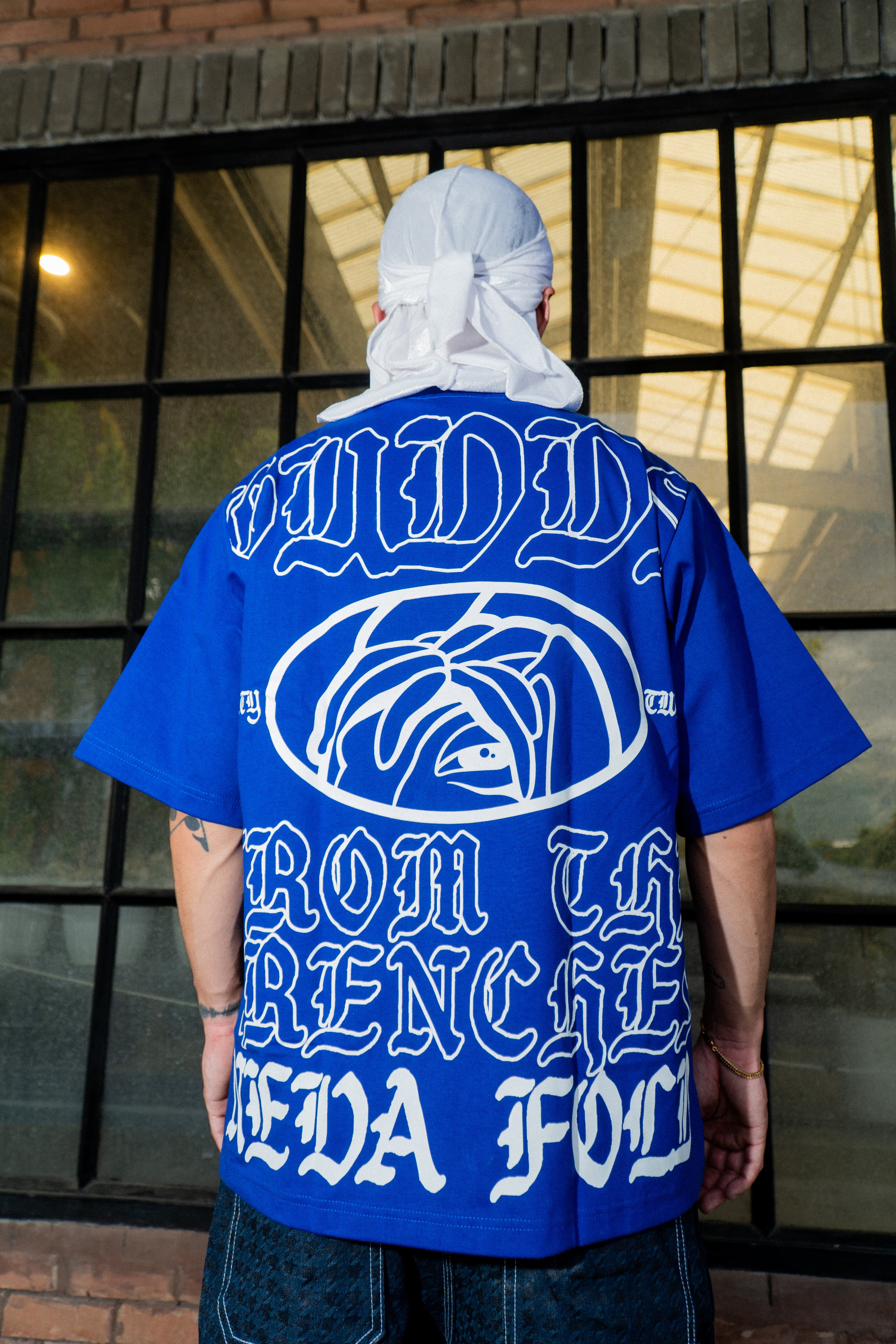 GUDDS UNIVERSE - "NEVA FOLD" BIG BACK PRINT TEE!