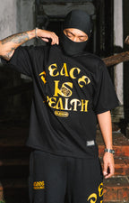 “PEACE IS WEALTH” GRAPHIC TEE