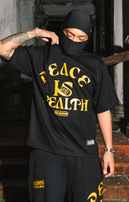 GUDDS UNIVERSE - “PEACE IS WEALTH” GRAPHIC TEE