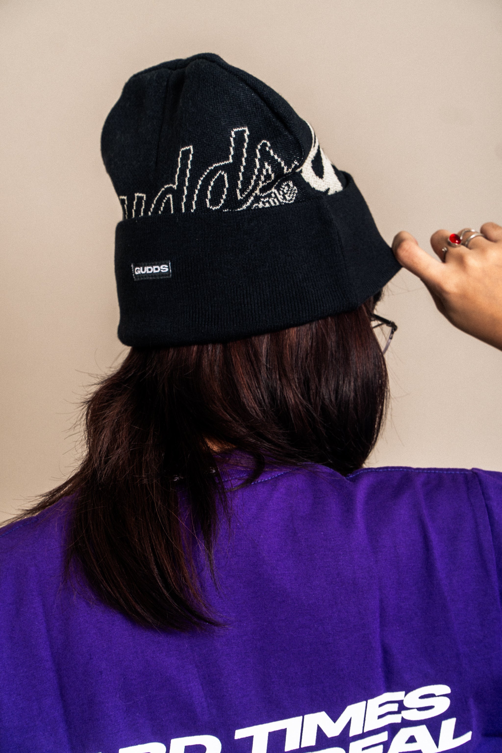 “CURSIVE” BEANIE WITH OVAL LOGO RUBBER PATCH