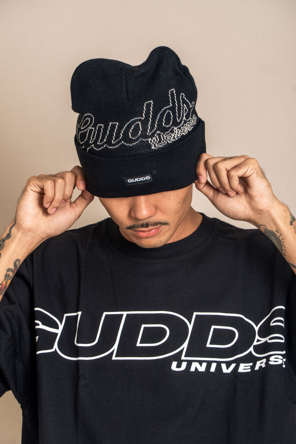 “CURSIVE” BEANIE WITH OVAL LOGO RUBBER PATCH