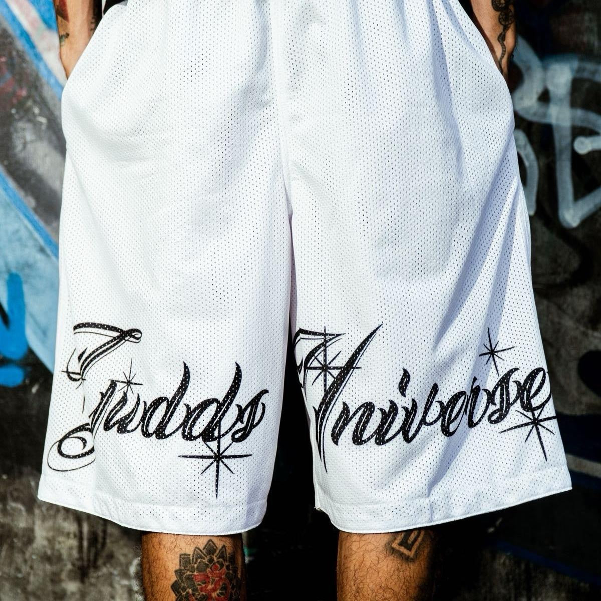 “CHICANO SCRIPT" MESH SHORTS